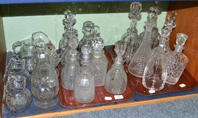 Lot 603 - A shelf including fourteen 19th century and later moulded and cut glass decanters with stoppers and