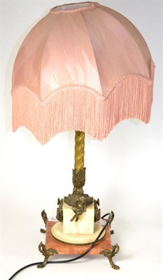 Lot 604 - A 1920's bronze mounted alabaster table lamp decorated with putti and acanthus leaves