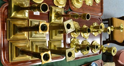 Lot 617 - Two trays of brass candlesticks to include three pairs of 18th century English candlesticks...