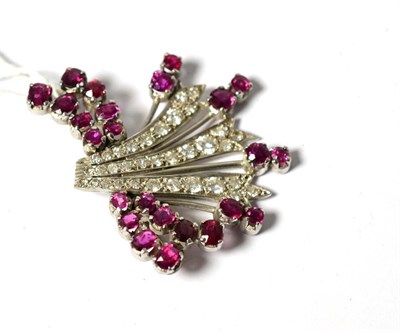 Lot 624 - A ruby and diamond spray brooch, set with various shaped rubies and round brilliant cut and...