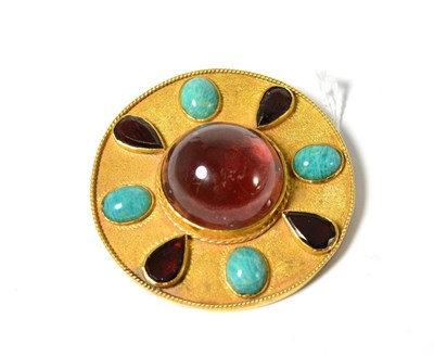 Lot 625 - A stone set brooch, the disk frame with a round cabochon stone centrally, and alternating pear...