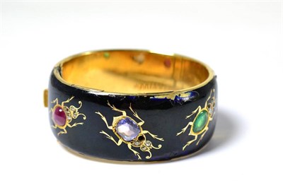 Lot 633 - A 19th century Russian insect bangle in 56 standard gold, enamelled and set with a pear cut...