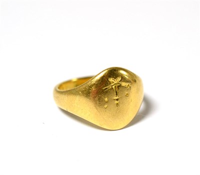 Lot 634 - An 18ct gold signet ring, the oval head engraved but one, finger size J 1/2