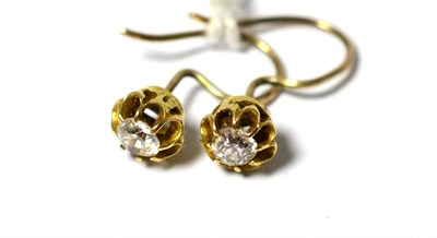 Lot 635 - A pair of diamond solitaire earrings, the old-cut diamonds in yellow claw and crimped settings,...