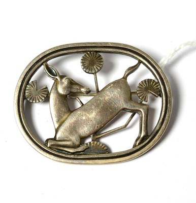 Lot 636 - A silver brooch, by Georg Jensen, model no.256, depicting a kneeling deer, measures 4.5cm by 3.6cm