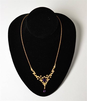 Lot 641 - An amethyst and split pearl set necklace, an oval cut amethyst within a scrolling articulated...