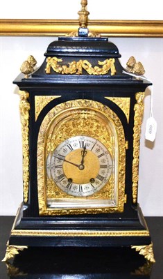 Lot 659 - An ebonised and gilt metal mounted striking table clock, circa 1890, inverted pediment, pierced...