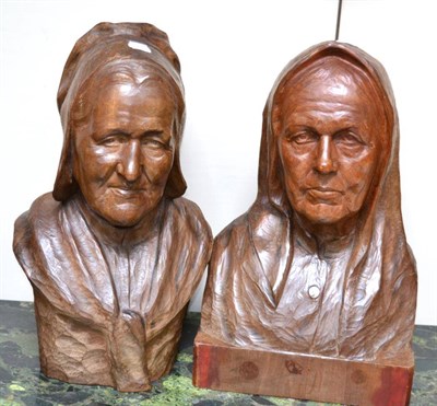 Lot 665 - Baudouin Tuerlinckx (Belgian 1873-1945): two carved oak busts, modelled as peasant women, 43cm high