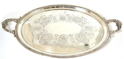 Lot 672 - A silver plated oval tray stamped Walker & Hall, 71cm diameter