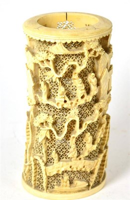 Lot 691 - A Cantonese ivory tusk vase, 19th century, carved with figures in a mountainous landscape on a...