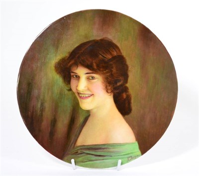 Lot 693 - A circular porcelain plaque hand painted with portrait of a lady by James Edwin Dean