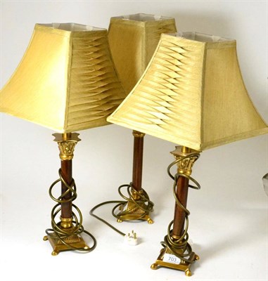 Lot 703 - A set of three modern decorative table lamps and shades