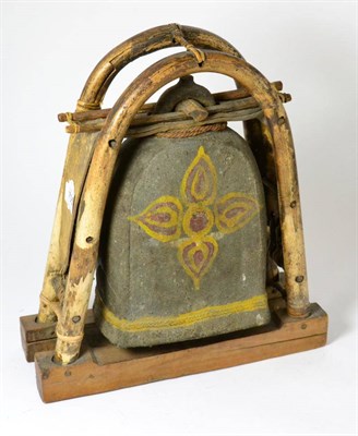 Lot 705 - A Tibetan bell, contained within bamboo frame, 38cm high