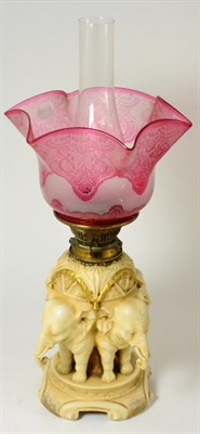 Lot 706 - An Austrian porcelain oil lamp base, circa 1900, in Royal Worcester style, modelled by as four...