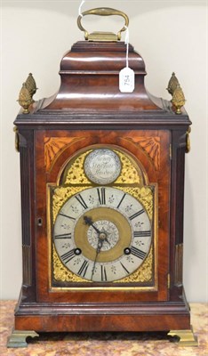 Lot 754 - A mahogany striking table clock, inverted bell top with a carrying handle and pineapple...