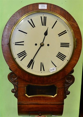 Lot 771 - An oak drop dial striking wall clock, circa 1880, side and bottom doors, trunk with a pendulum...