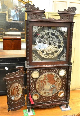 Lot 776 - An unusual striking table clock, early 20th century, Chinese style case with applied white...