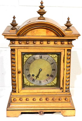 Lot 779 - ~ A walnut quarter striking table clock, circa 1890, arched top with turned finials, brass dial...