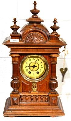 Lot 782 - A musical polyphon striking mantel clock, circa 1900, arched pediment with turned finials,...