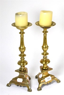 Lot 788 - A pair of brass altar candlesticks, probably Italian, late 17th/early 18th century, the...