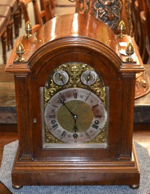 Lot 792 - An oak chiming table clock, circa 1890, arched case with side sound fret doors, 6-inch arched brass