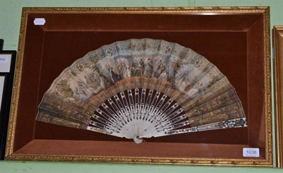 Lot 1036 - A 19th century fan with lithographed leaf in a glazed display case