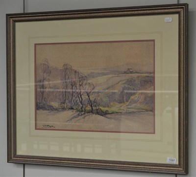 Lot 1097 - William Hoggatt RI, RBC, RCamA (1880-1961) An extensive view of a coastline at dusk, signed,...