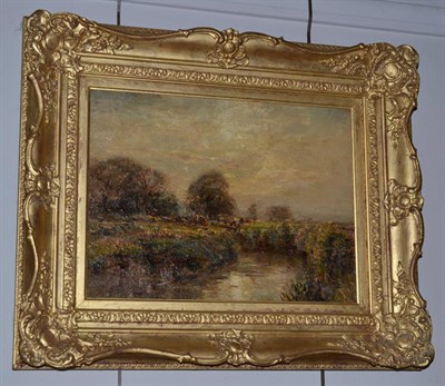 Lot 1178 - Herbert Royle (1870-1958) Cattle grazing in a river landscape at sunset, signed, oil on canvas,...