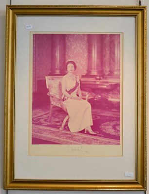 Lot 1204 - ~ Framed photograph of Queen Elizabeth, signed and dated 1973; together with a signed photo of...