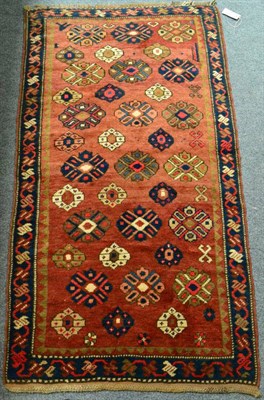 Lot 1223 - Karabagh rug, South Caucasus, the abrashed field of large stylised flowerheads enclosed by...