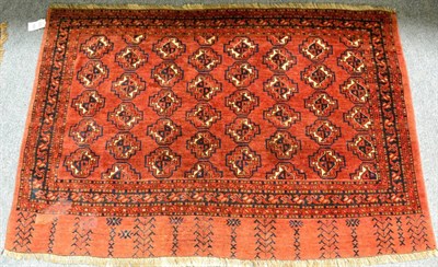 Lot 1224 - Ersari Chuval, North Afghanistan, the madder field with columns of quartered guls enclosed by...