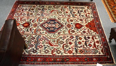 Lot 1225 - Afshar rug, South East Persia, the cream ground with plants and zoomorphic devices around an indigo