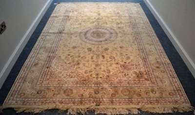 Lot 1228 - * An Oriental silk carpet, probably China, the cream field of scrolling vines around a...