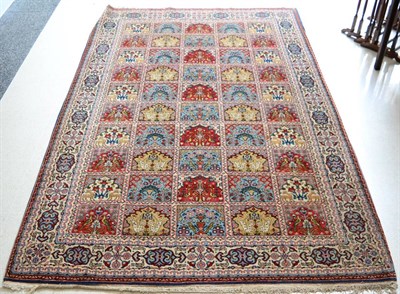 Lot 1232 - Ghom rug, Central Persia, the polychrome compartmentalised field of Mihrabs enclosed by ivory...