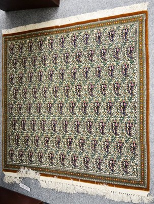 Lot 1244 - Ghom rug, Central Persia, the ivory field of leafy vines and boteh enclosed by narrow...