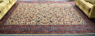 Lot 1252 - Mashad carpet, North East Persia, the cream field with an allover design of scrolling floral...