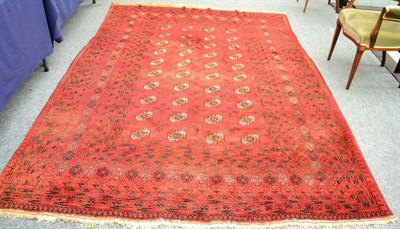 Lot 1266 - Turkman carpet, North Afghanistan, the field with four rows of quartered guls enclosed by...