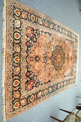 Lot 1274 - Tabriz carpet, Persian Azerbaijan, the faded apricot field of scrolling vines around an indigo pole