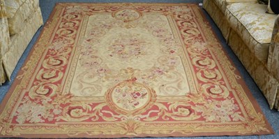 Lot 1276 - An 'Aubusson' carpet, China, the cream field centred by a floral medallion and scrolling...