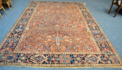 Lot 1279 - Heriz carpet, Persian Azerbaijan, the terracotta field of angular vines and stylised plants...