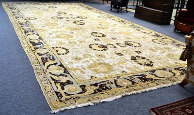 Lot 1281 - Large carpet of Agra design, probably North Afghanistan, the ivory field with an allover design...