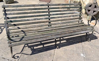 Lot 1285 - A Victorian garden bench with wooden slats