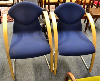 Lot 1295 - A pair of retro style sprung chairs of recent date with birds-eye maple arms