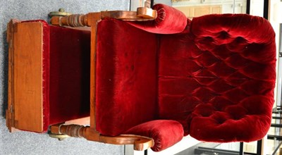 Lot 1310 - + A Victorian invalids chair, later recovered in red velvet, raised on brass wheels, labelled...