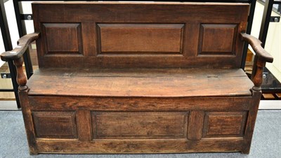 Lot 1311 - + An 18th century English joined oak box settle