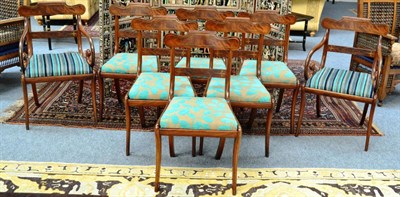 Lot 1325 - A set of eight Regency mahogany sabre and brass inlaid dining chairs