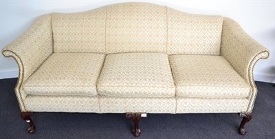 Lot 1344 - A Chippendale style three seater sofa, later recovered in floral close nail fabric