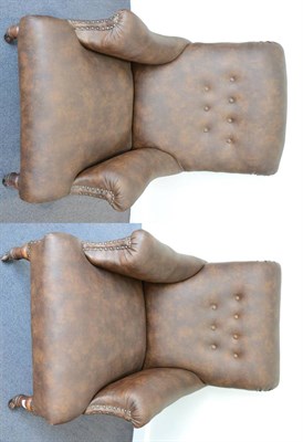 Lot 1349 - ~ A near pair of late Victorian armchairs, later recovered in close nailed brown leather