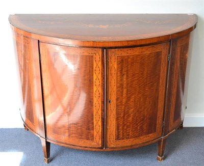 Lot 1355 - ^ A George III style satinwood and marquetry inlaid commode