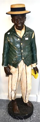 Lot 1371 - A reproduction plaster black minstrel figure